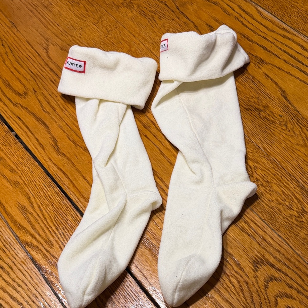 Hunter brand boot socks inserts.  Cream color with logo on front.